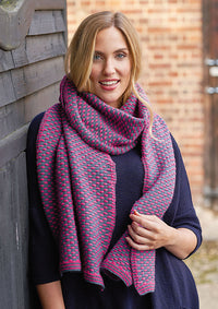 Young woman wearing a knitted scarf and sweater