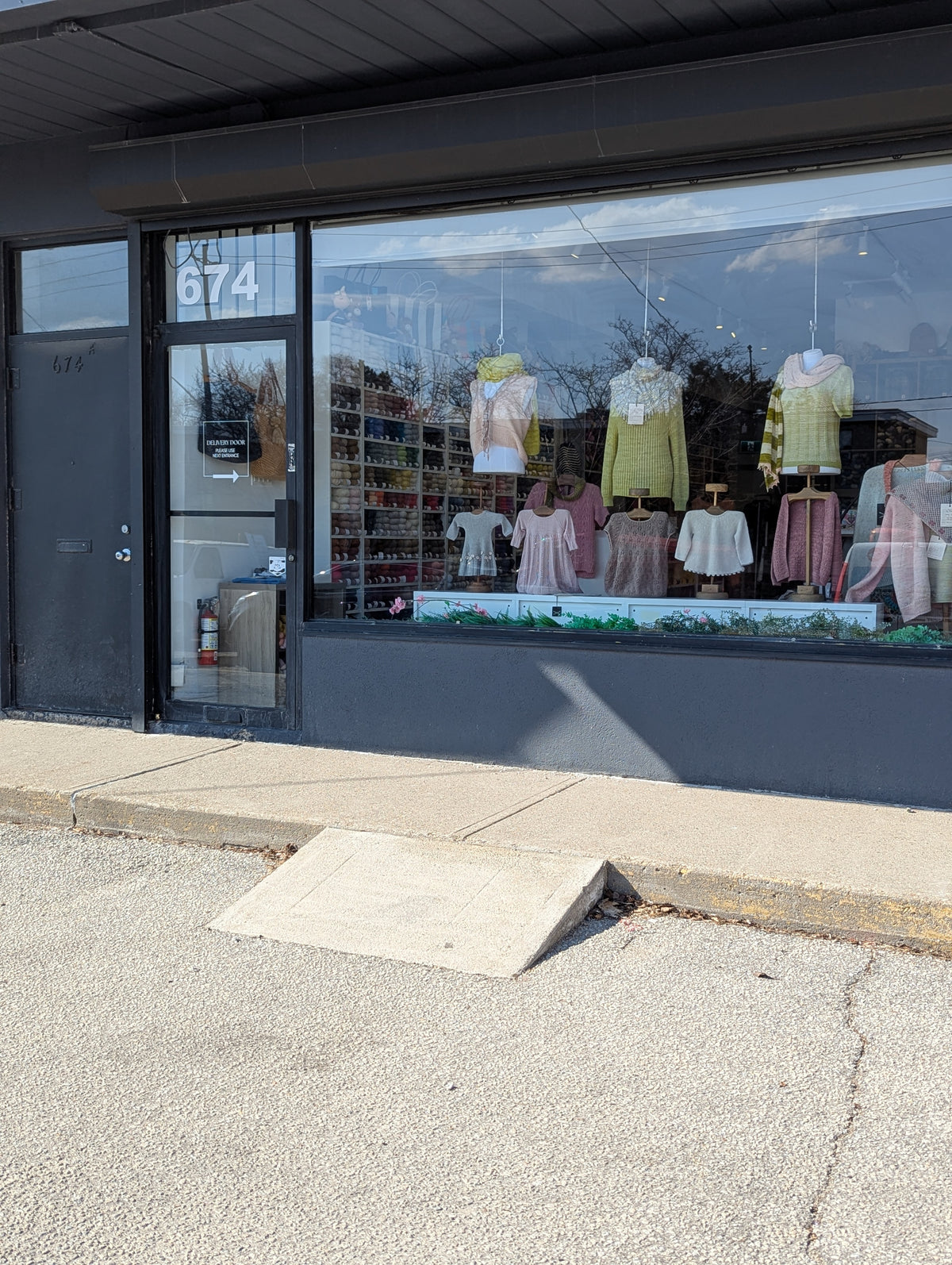 Front of store with curb and concrete ramp