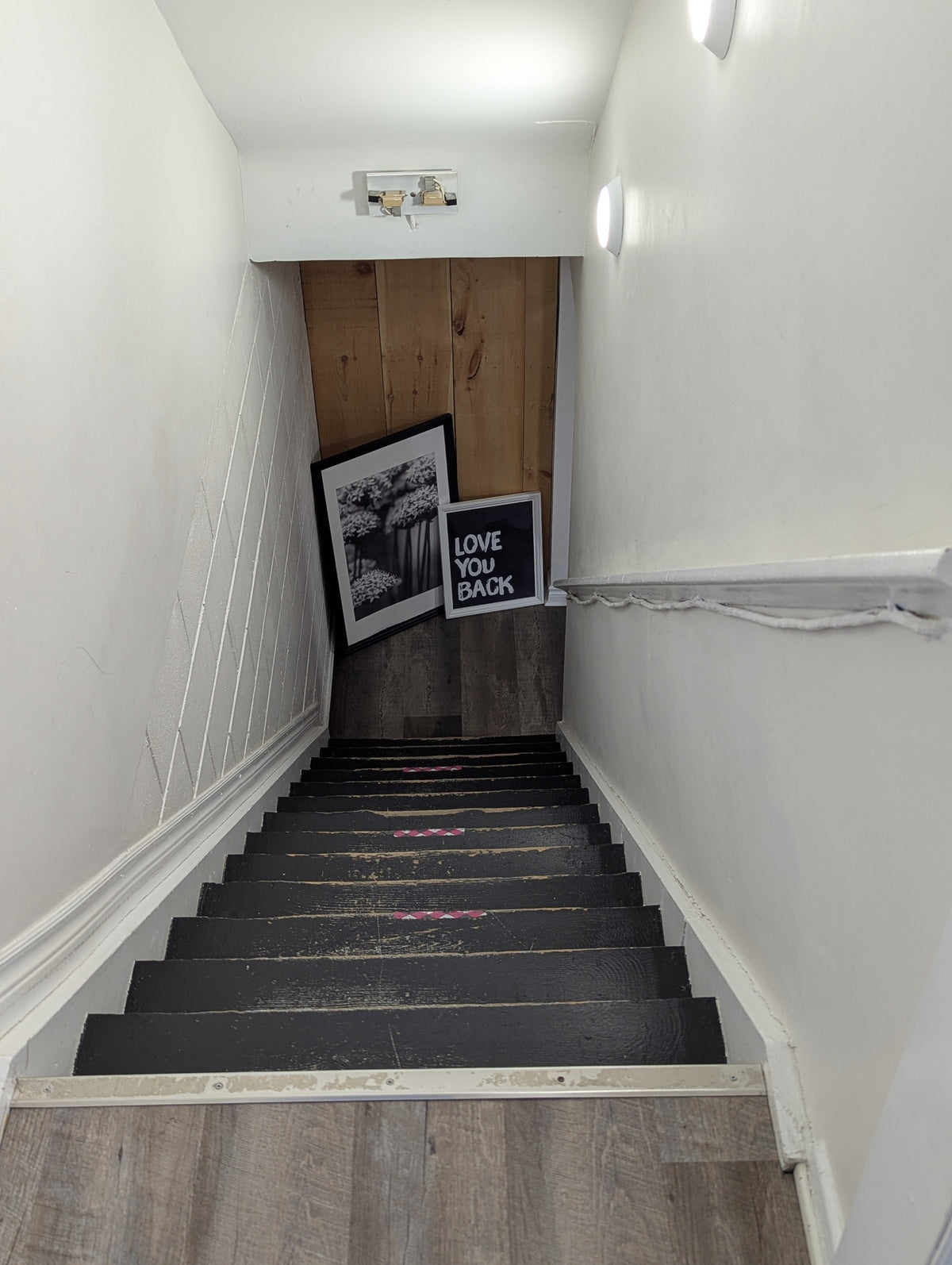Basement stairwell with hand rail on right side