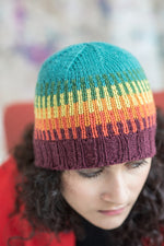 Woman wearing multi-coloured knitted beanie cap