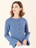 Young woman wearing blue knitted sweater