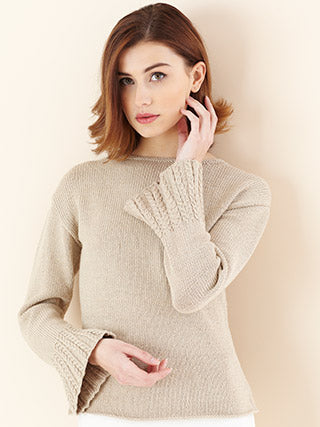 Young woman wearing flared sleeve knitted sweater