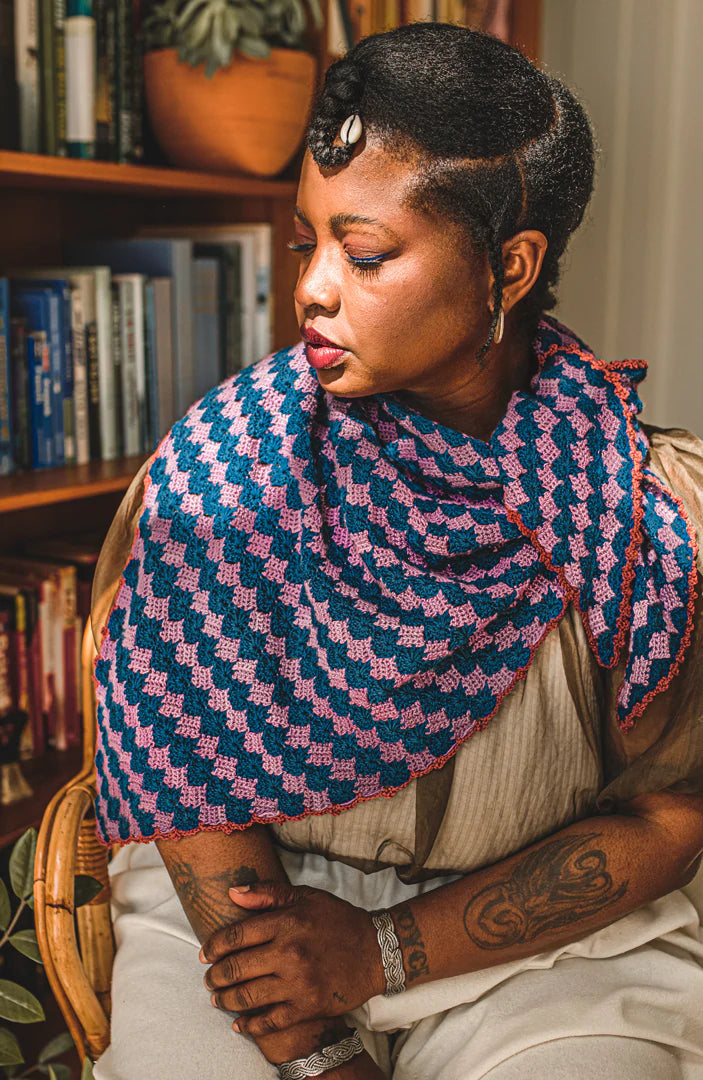 Tattooed woman wearing knitted shawl
