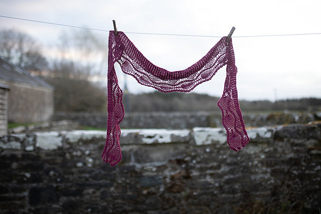 Knitted shawl hanging on clothesline