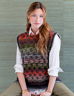 Young woman wearing colorful knitted vest