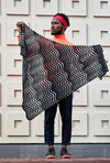 Man holding knitted shawl