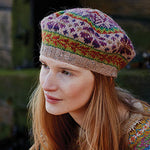 Woman wearing colourful knitted tam hat