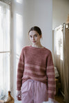 Young woman wearing knitted sweater