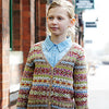 Girl on sidewalk wearing colourful knitted sweater