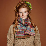 Red haired woman wearing knitted sweater and scarf